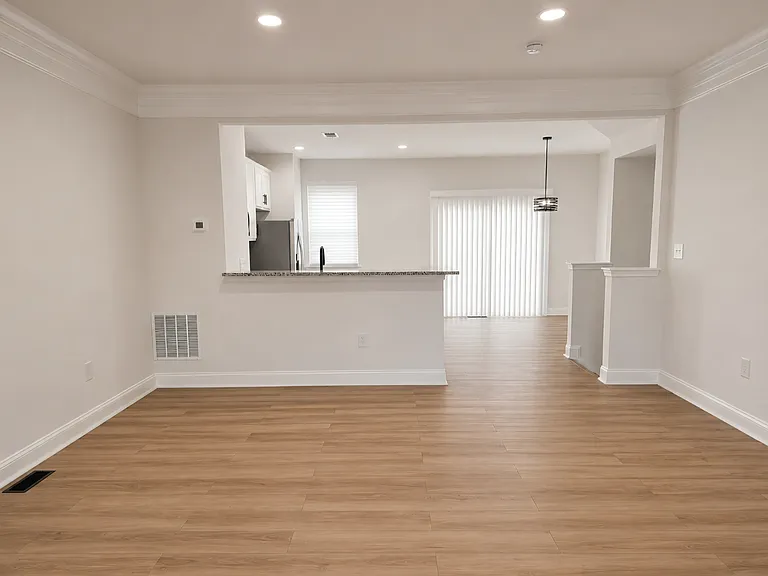 Open concept living room, kitchen and dinning room.