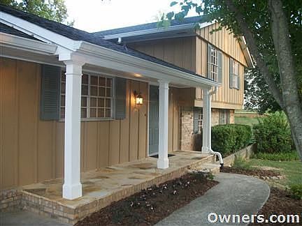 Front view of house with flagstone porch.