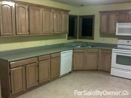 Spacious Kitchen : Includes flat surface stove, above stove microwave, dishwasher, s.s. fridge