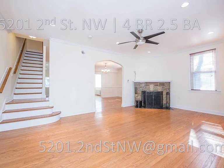 Roomy living room with fireplace.