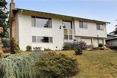 Classic two-story split level home sits proudly in this established neighborho