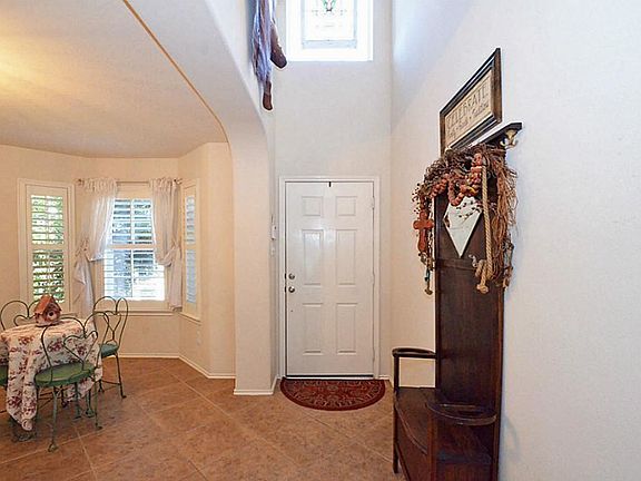 Two Story entry beautiful oversized tile throughout downstairs.