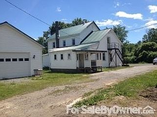 Back of house with garage
