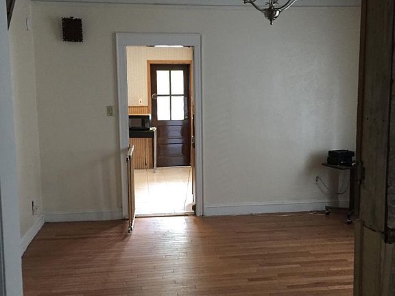 Dining room is right next to large eat in kitchen.