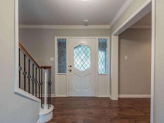 Great entry way with designer paint and beautiful hand scraped flooring throughout most of the downstairs!