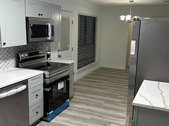 Kitchen, new refrigerator, flooring, light fixtures, and more