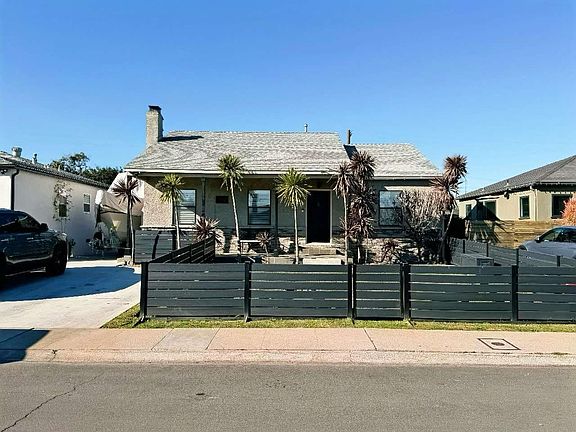 Driveway that extends to the 2 car garage in the back of the property