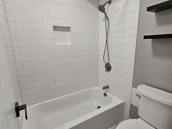 Hall bathroom shower and toilet