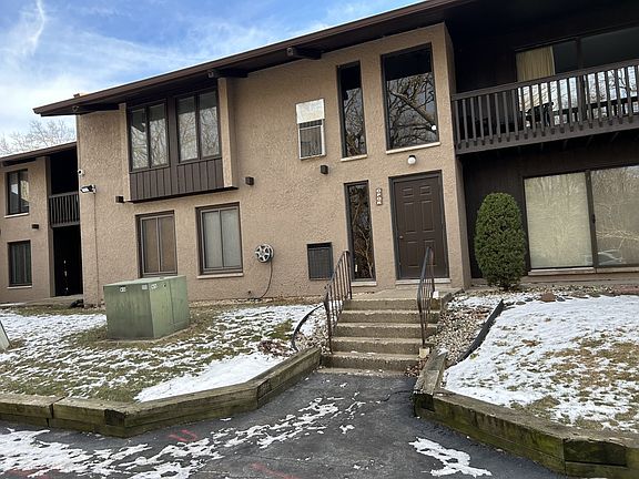 Back of condo facing parking lot, swimming pool/clubhouse.