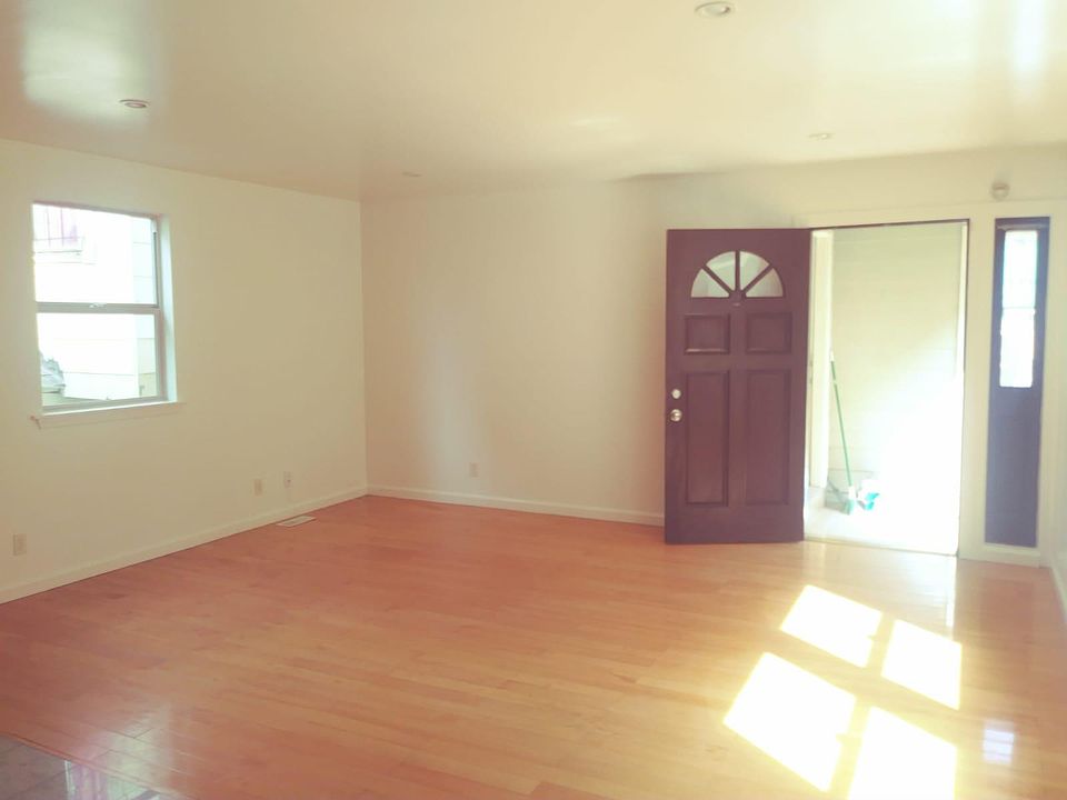 Entry door and spacious living room