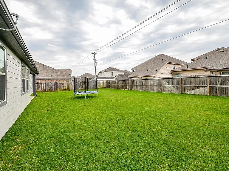 Backyard. Big enough to setup a full size volleyball court with room left over.