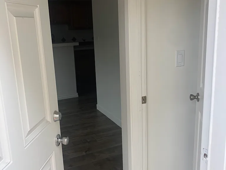 Entrance door. On right is private bedroom with restroom and closet.