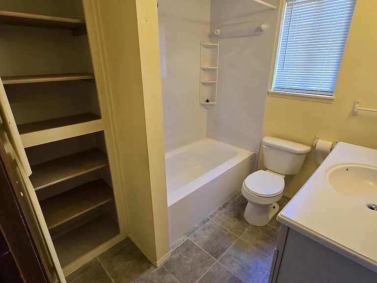 Main bathroom with spacious cabinets for storage