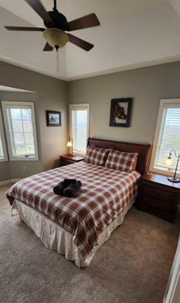 Cozy queen-sized second bedroom with a bathroom, offering comfort and convenience for guests.
