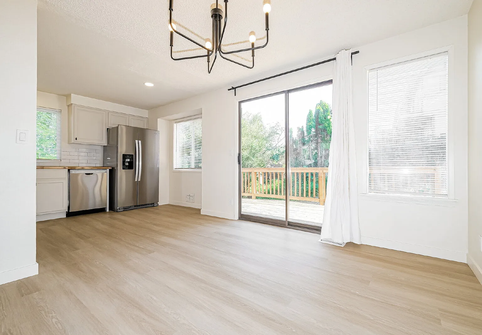 **Fully Remodeled 3+ Bedroom Home With Large Wraparound Deck Available Now For Rent** — Photo 3