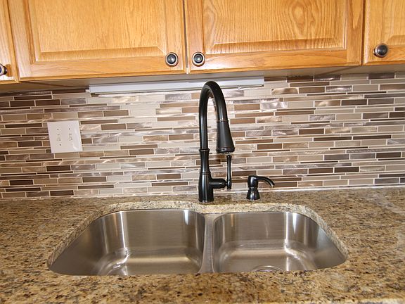 Under mount, double bowl 60/40 sink.