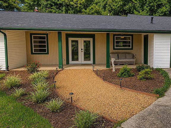 Front porch entrance. Patio furniture included or can be removed.