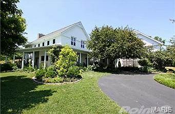 Front entrance into property along circular driveway.