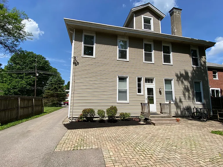 Driveway leading to the parking lot and lawn