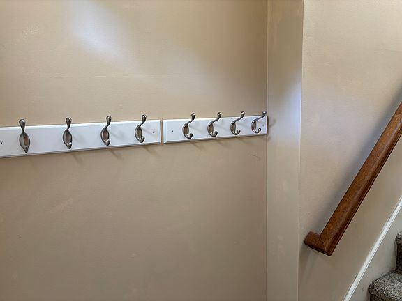 Coat hooks behind front door