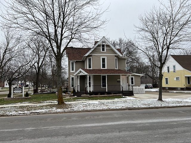 View of entrance to apartment from street; door faces Friendship Street. Corner of Broadway & Friendship.