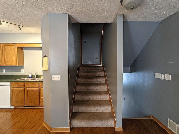 Stairs to bathroom and bed