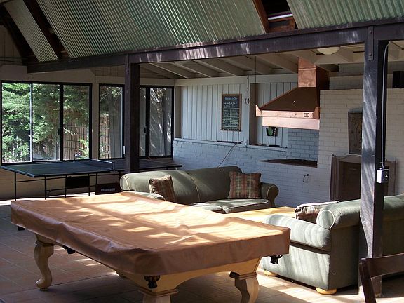 Game room with Pool Table, Table tennis, Fireplace.