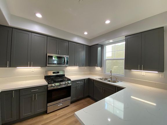 newly renovated kitchen with quartz countertops