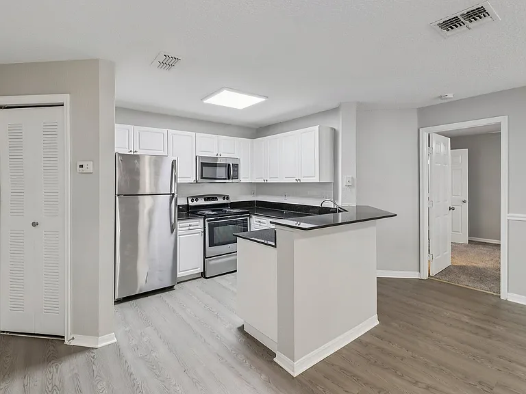 Modern kitchen with sleek finishes and convenient breakfast bar