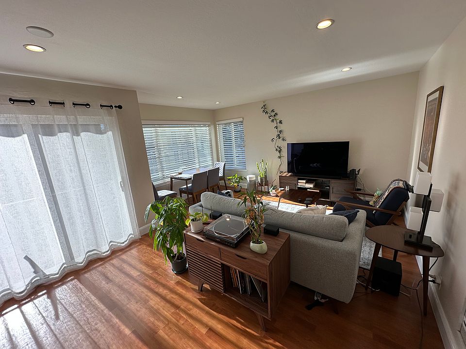South facing living and dining room with lots of sunlight and recessed lighting