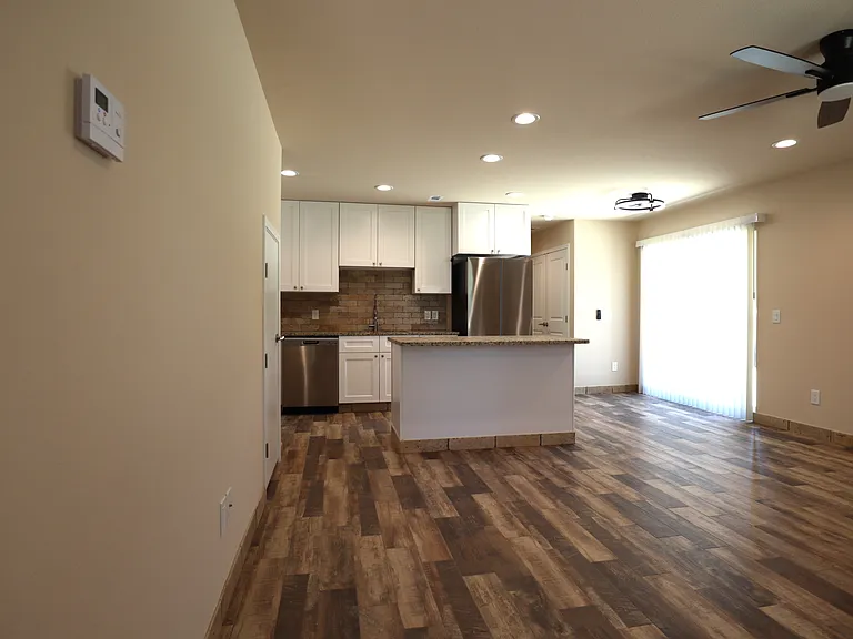 LIVING ROOM LOOKING INTO KITCHEN