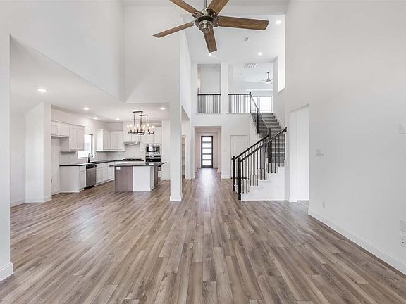 Garland floor plan by Pacesetter Homes featuring open-concept living, a covered patio, and an upstai
