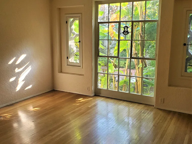 large living room with beautiful windows and views