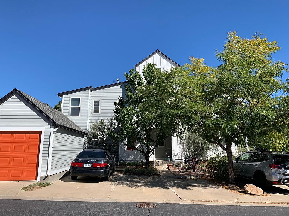 Building front. Freshly painted with new carpentry work. Dedicated parking spot under tree