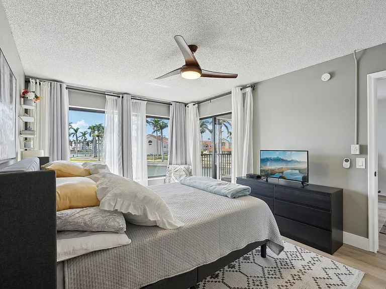 Master bedroom features expansive lake views.