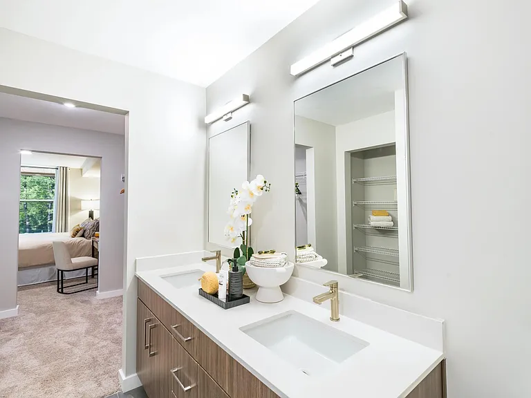 Spa-inspired serenity with a double vanity and quartz countertops designed for everyday luxury.