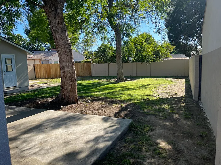 Large backyard with two patio areas. Great for pets and entertaining.

Detached garage with door access, lots of natural light and Air Conditioning.