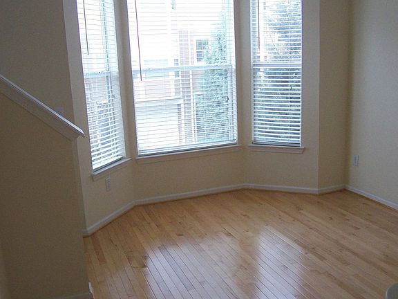 Living Room with 9ft Ceilings, Hardwood floors, and Bay Window