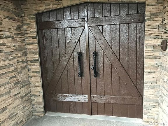 Custom "one of a kind" front doors! Built to last and built by the original owner!! What an entry!! 