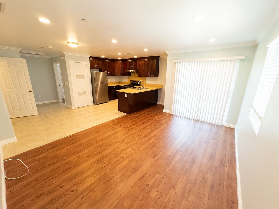 Living room, dining area and kitchen