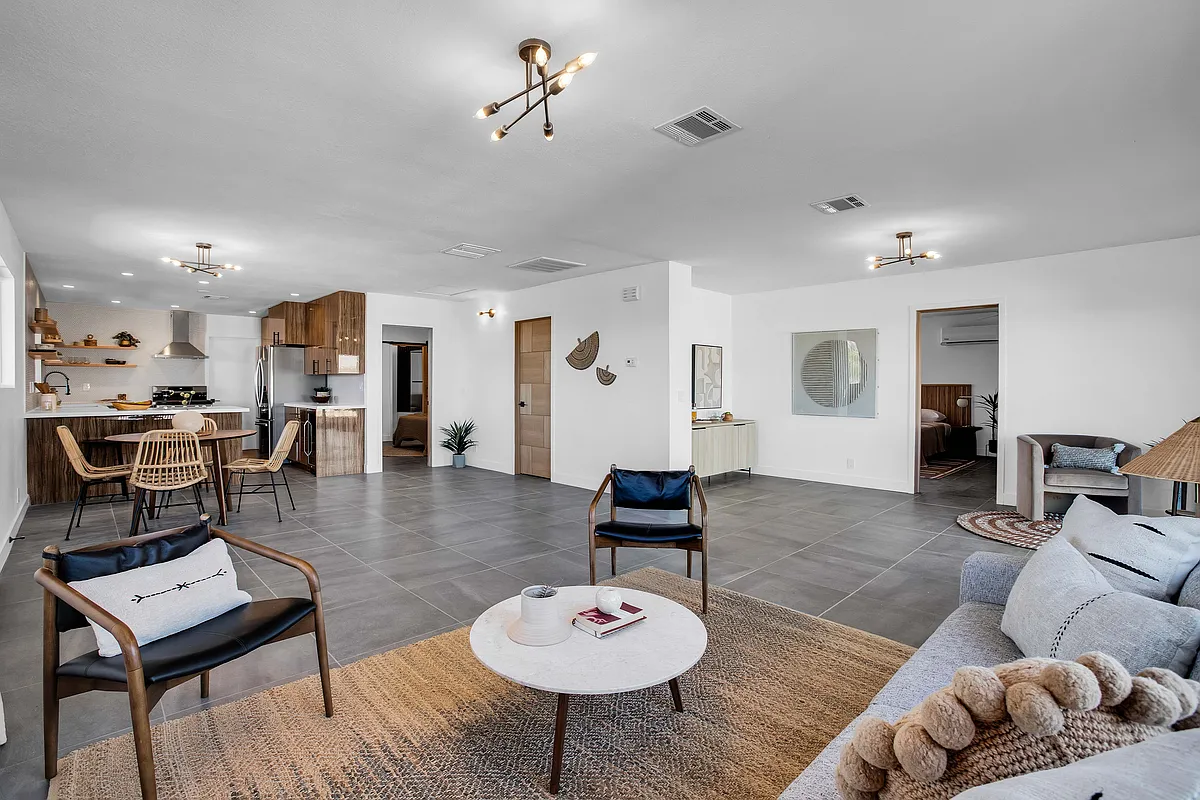 A wonderfully open concept that connects living/dining areas to the kitchen! The bathroom and primary/guest bedrooms are easily accessible from the main area. - 6732 San Angelo Ave