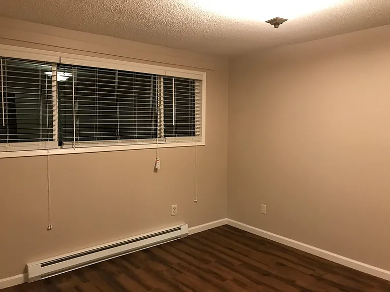 Larger Bedroom. Full sized closet approximately 8ft. with 3 sliding doors.