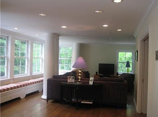Great room open to kitchen, walls of windows