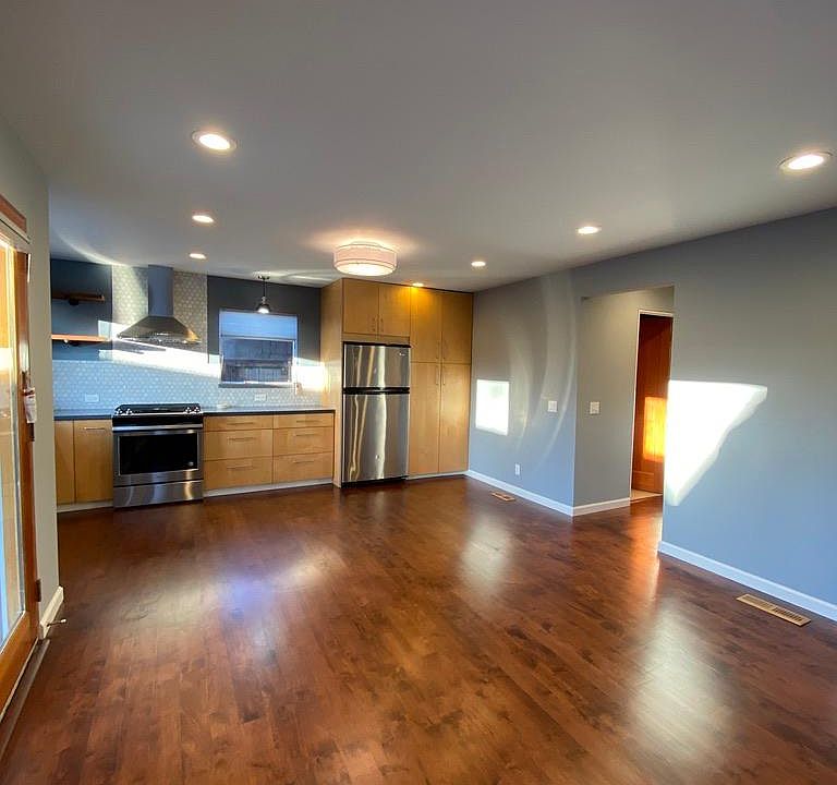 Kitchen and living room with new hardwood floors and new remodeled kitchen