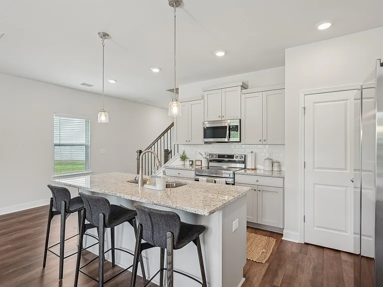 Elegant living area with a seamless view of the home's living and dining spaces.