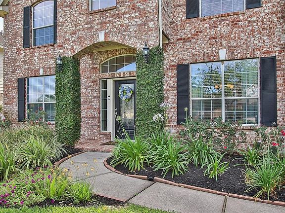 Beautifully landscaped with incredible curb appeal