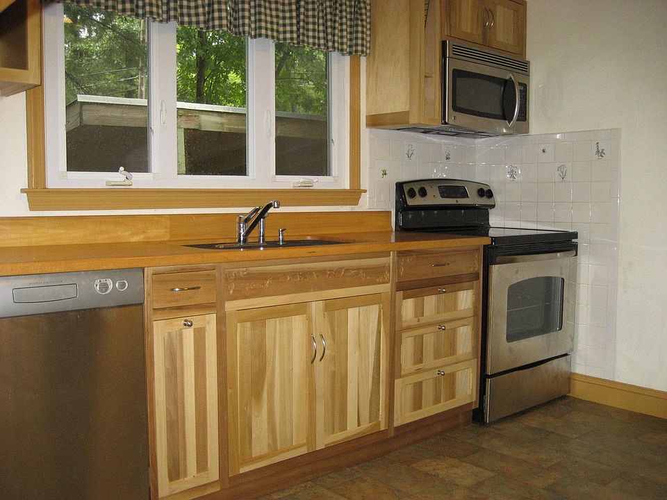 Kitchen with new GE cook top stove and sensor microwave