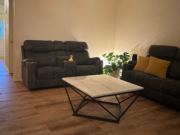 Living Room flows to the kitchen/dining area.