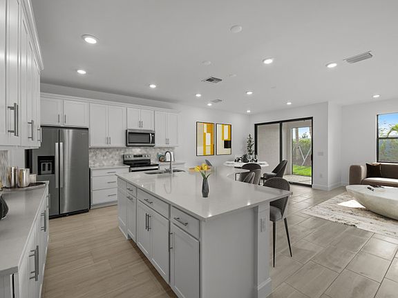 Large center island in the open concept kitchen