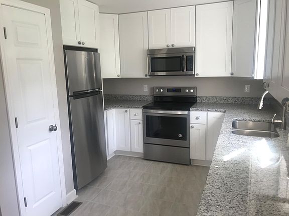 Lots of cabinets, pantry, granite tops and lazy susans in corners for storage. Pull out spray faucet, deep 60/40 sink, stainless appliances and icemaker. A gourmet's dream kitchen.